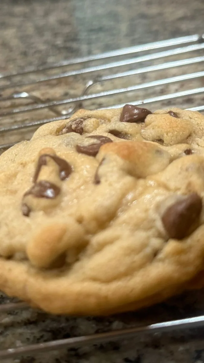 perfect chocolate chip cookie cooling on a rack