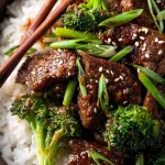 beef and broccoli dish served over fluffy jasmine rice