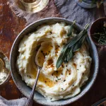 bowl of celery root mash, swirl of browned butter